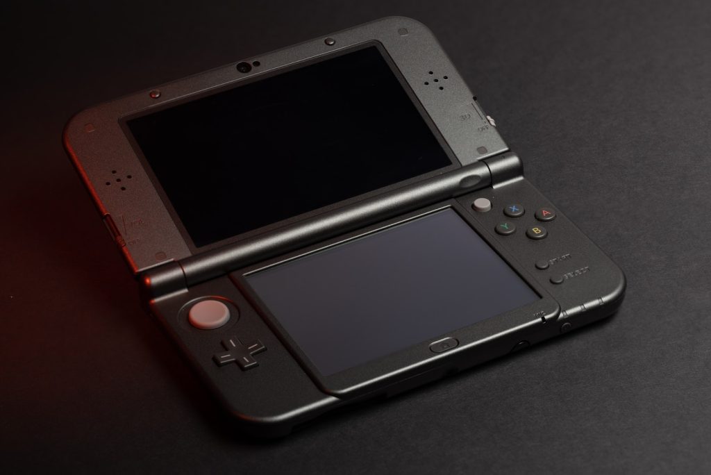 Black Nintendo Game Boy on Black Textile